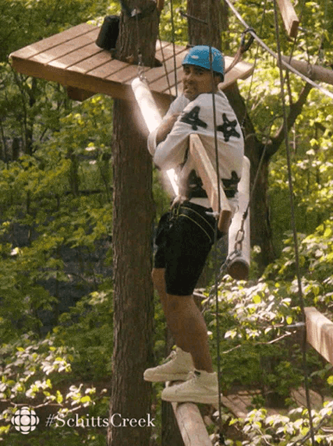 From TV show Schitt's Creek, the character of David Rose is miserably trying to navigate a ropes course, despite being deathly afraid of heights. 